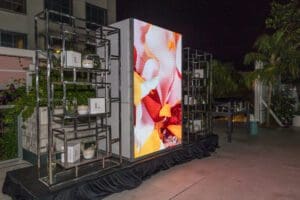 Photo of LED Screen with video and shelving for a Blue Spark Event Design - Product Launch Miami
