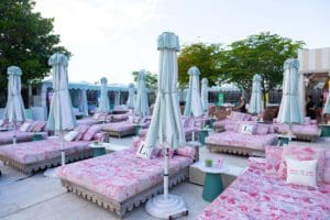 Photo of custom pillows on pool daybeds for a Blue Spark Event Design - Product Launch Miami