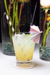Photo of a Yellow Custom Drink with straw and Umbrella - Blue Spark